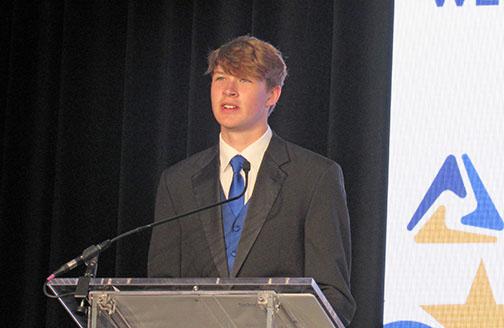 Aurora senior Graham Christenson addresses a large crowd during the state FBLA conference in Kearney.