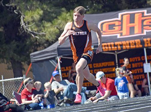 Phillip Kreutz, shown here in an event earlier this season, won both the 400 and 800 races at Staurday’s Twin Valley Conference meet as the boys won the team title for the first time. 