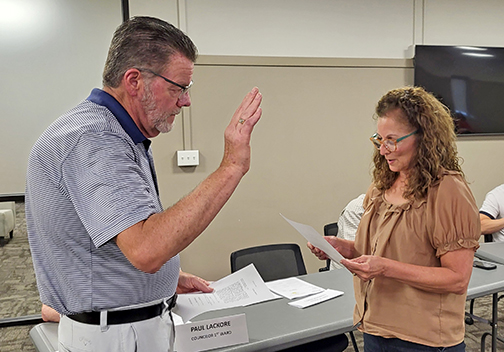 Aurora businessman Todd Jensen takes the oath of office to become a city councilman representing Ward 1