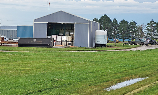 High winds from Wednesday night's thunderstorm tore three doors off this warehouse building at the Aurora Airport