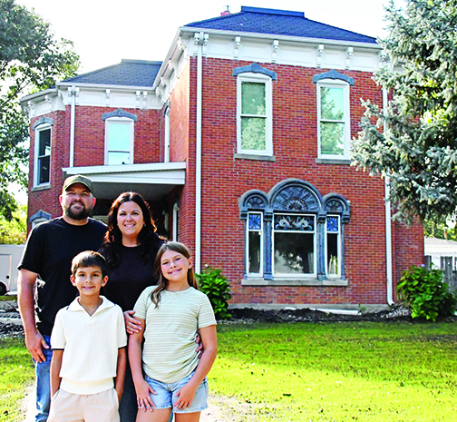 After five years of operating the Otto House as an Airbnb, Andrew and Taylor Willis decided to turn this historic house into their forever home. The couple is pictured in front of the newly restored house with their children, Ledger and Austyn.