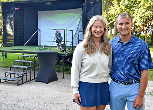Grayce (Gustafson) and Connor Smith have started their latest business, Cross Swing Golf, offering a mobile golf simulator that can be brought in for after-school dances, corporate events, weddings and more.