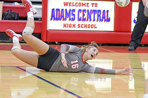   Aurora senior Kassidy Hudson saves a ball from hitting the floor during the Lady Huskies’ 3-1 match victory over Adams Central. Hudson was the leading attacker in the match, totaling 19 kills. 