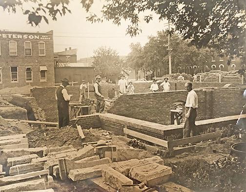This photo, taken in September of 1916, shows construction being done for the basement portion of the Aurora post office building, in its current location. 