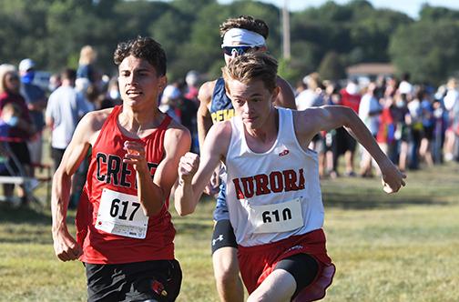 Max Wiarda gives one last push at the finish line during the Seward Invite to hold his position against the field. News-Register/Jeni Moellenberndt