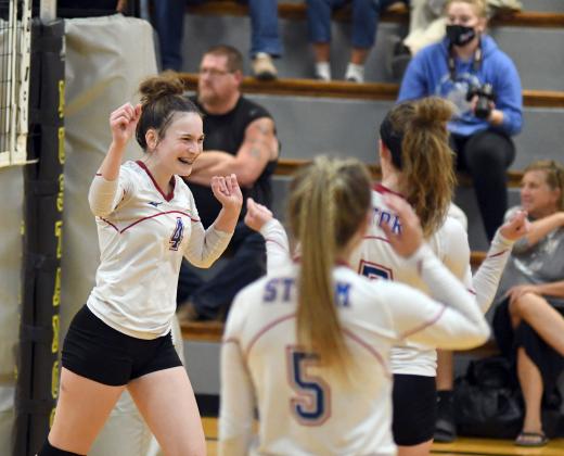 Alexis Kalkwarf celebrates a point during HPC's five-set win over McCool Junction. 