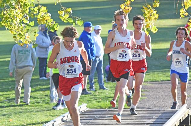 Lucas Gautier (left), Max Wiarda and Isaac Bisbee keep their pace during the C-4 District Meet. All three runners finished within 10 seconds of each other.
