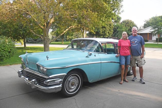 Sue and Wayne Deininger stand by the 1958 Buick Special which Sue was given by her parents and drove years ago while in high school.