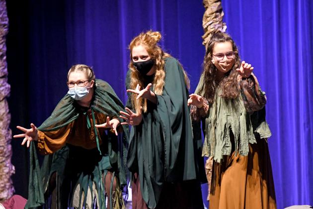 From left, Kimberly Friesen, Riley Wert, Emma Bullerman are the three witches in Aurora’s one-act performance of Mmmbeth, putting a fun twist on actual witches.