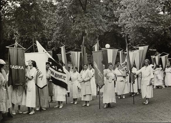 Photo courtesy of the Library of Congress archives // National Woman’s Party members standing in line with banners during the dedication ceremonies for the Alva E. Belmont House, 1922. Among the banners are those reading “Nebraska,” “California Republic,” Connecticut.”
