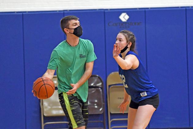 Mack Alspaugh, new HPC girls basketball coach, helped run 5-on-5 drills during practice over the Thanksgiving holiday. 