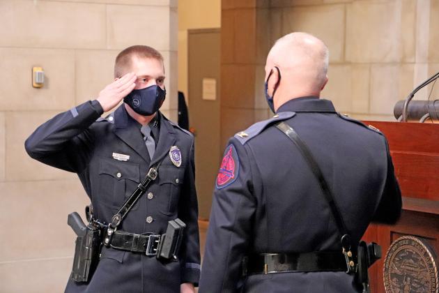 Courtesy photo // Grant Moody (left) of Aurora salutes Colonel John Bolduc after receiving his badge during the 63rd Basic Recruit Class.