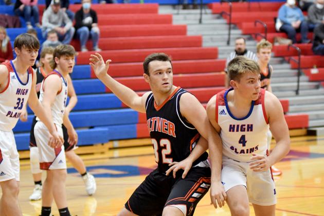 Giltner’s Jacob Smith calls for the ball over HPC’s Lane Urkoski. Smith led the team with 10 points and seven boards, five of which on the offensive glass. 