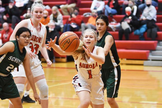 Aurora’s Ellie Hutsell (1) chases down a loose ball in the second half of the Lady Huskies’ 75-13 win over Schuyler. 