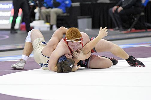 Aurora’s Brekyn Papineau had an eventful state championship event, recording his 100th career victory while finishing third at 195 as one of five medalists for the Huskies. 