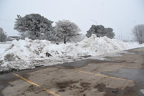 City crews used the 4-plex parking lot to store excess snow from last week's 10-inch storm.