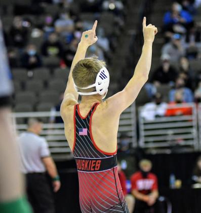Caden Svoboda points to the Aurora supporters after his quarterfinal victory. 