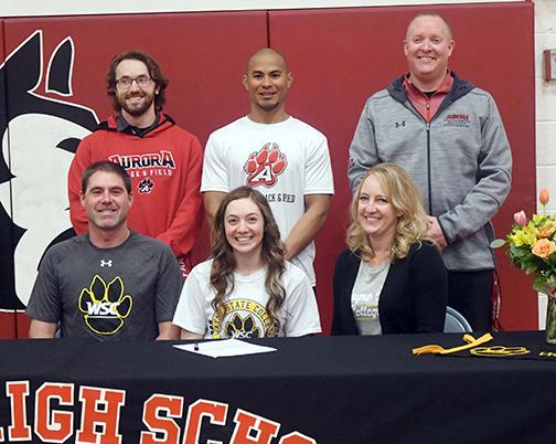 Emily Erickson signed with Wayne State for track and field alongside her parents, Kirk and Valerie Erickson and Aurora coaches AJ Farrand, Mike Crosby and Gordon Wilson. 