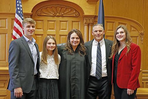 New District Judge Lynelle Homolka (center) was joined for her swearing-in ceremony by her family, from left: Cayden Homolka, Sydni Homolka, Charles Homolka and Gabriella Homolka. 