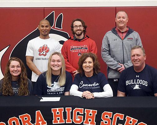 Jaylee Schuster signed with Concordia University alongside her parents, Scott and Dara along wtih her sister, Kasey and Aurora coaches Mike Crosby, AJ Farrand and Gordon Wilson. 