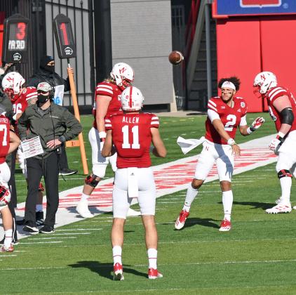 Austin Allen warms up with Husker QB Adrian Martinez before the Penn State game last season. 