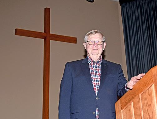 Pastor Rod Goertzen stands at the pulpit of the Countryside Bible Church, where he has been serving for part of his 60-year career.