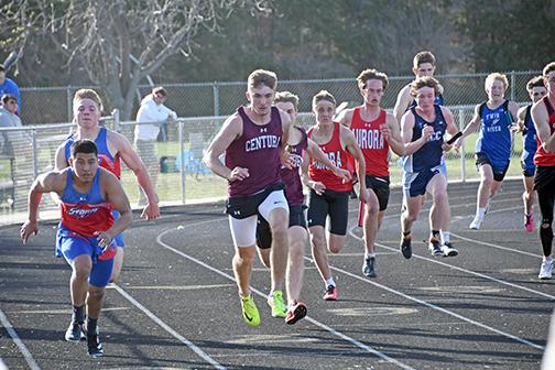 The High Plains and Aurora 400 relay teams were in the outside lanes during Monday’s CNTCs in GI. HPC’s Javier Marino takes the handoff from Lane Urkoski in the outside lane while Aurora’s Carsen Staehr takes the baton from Jacob Settles in lane six. 