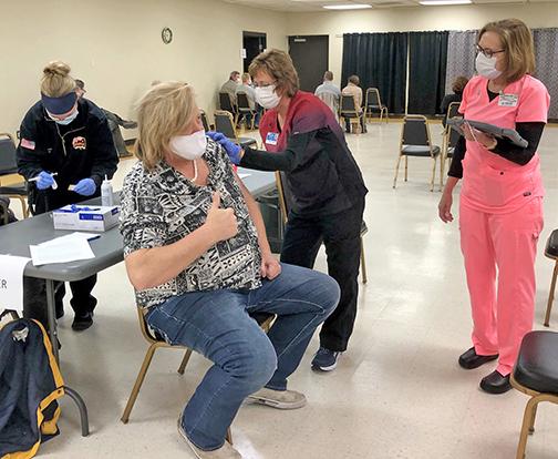 Matt Messner of Polk gave the thumbs up Thursday as he received his COVID-19 vaccination during an MCHI clinic at the Bremer Center.