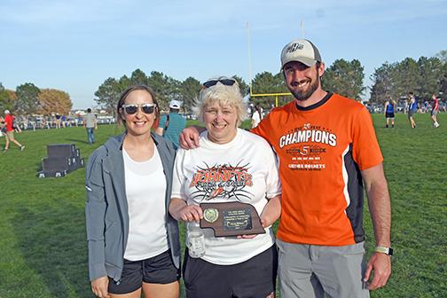 Giltner track coach Nancy Lockmon received the 2021 CNTC coach of the year award during Monday’s meet. She was joined by Hornet assistant coaches Kirsten Kreutz (left) and Chip Bartos. 