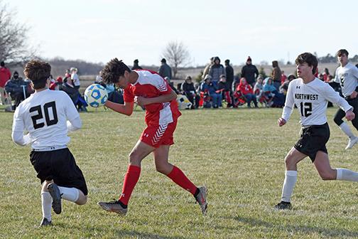 Aurora’s Alexander Wheeler came up just short on this header attempt during second half play against Grand Island Northwest March 30, a 3-0 loss to the Vikings. 