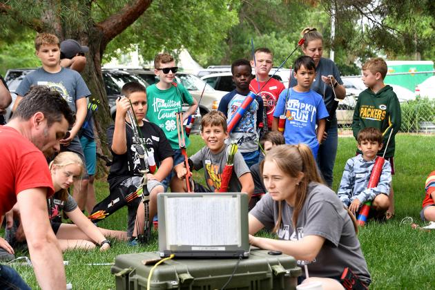 Edgerton staff members Nichole Havlik, right, and John Boeder, use a high-tech camera to show youth campers shooting images captured using ultra high-speed photography.