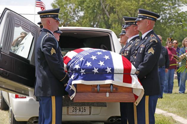 An honor guard took care of Lyle's casket, removing it from the hearse and standing guard.