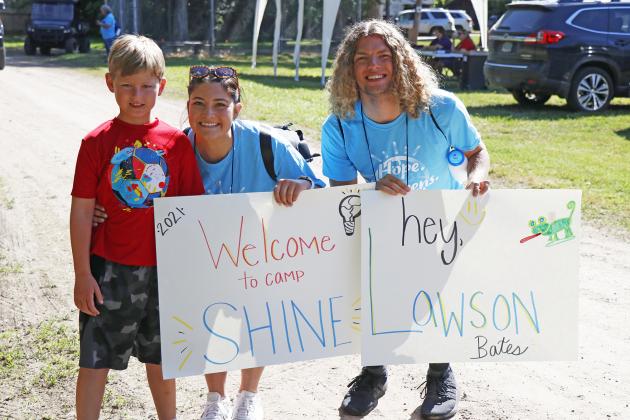 Lawson Bates (left) was welcomed to his first ever Operation Shine Camp by big campers Hailey Holliday (who is also his babysitter) and Cole Hepner.