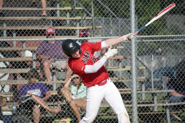 Aurora Pinnacle Bank Seniors player Dillon Wiarda takes a hack at the plate during a loss to Wood River Sunday. 