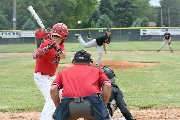 Dylan Dubas (pitching) smacked his older brother Tyler in the back with this pitch during the Aurora Alumni baseball game Saturday. 