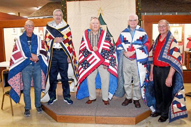 Those given Quilts of Valor include from left: Curt Carlson, James William Kaura, Bryon “Butch” Lewin, Gary E. Ross and Marlin Seeman.