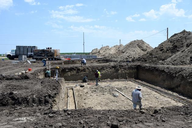 Construction crews were busy Friday putting down forms to pour the first basement in 14 homes expected to be built this year in a new housing subdivision on the east side of Phillips. Rising lumber costs increased the target price from $217,000 to $259,000.
