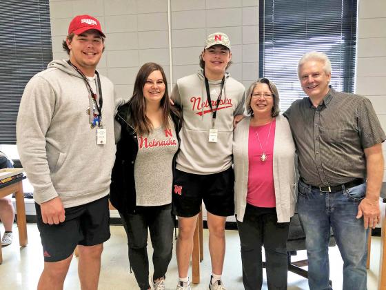 Ian Boerkircher (left) visited his sister Abbie Woodward along with other brother Nate Boerkircher. Stopping by to snap a picture with the Husker players were fellow Aurora alumni Kerry McBride and John Leininger.