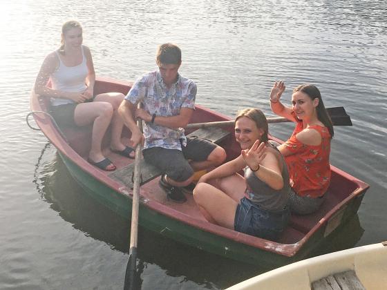 Domi (left), Hermann, Bailey Howland and Fanni enjoy a boat road on the pond at Edenkert Panzio.