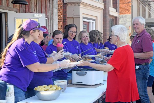 Hampton Public School staff members donned purple shirts for Friday’s event and volunteered to serve up free barbecue for a crowd estimated at more than 500 people.