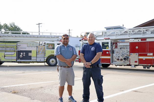 Hamilton County will now be served by two ladder trucks at the Aurora and Giltner fire departments. Aurora passed off its green 65-foot ladder truck to Giltner Fire Chief Brad Consbruck (left) last week, and Aurora Fire Chief Tom Cox welcomed a 100-foot ladder truck to the Aurora fleet. 