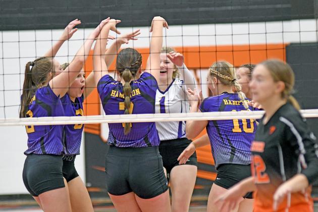Hampton celebrates a point during its two-set win over Giltner Thursday.
