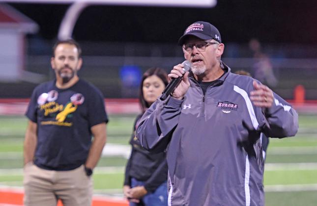 Gary Peters speaks during half-time of Friday’s home football game about the mission and research of the Pediatric Cancer Action Network.