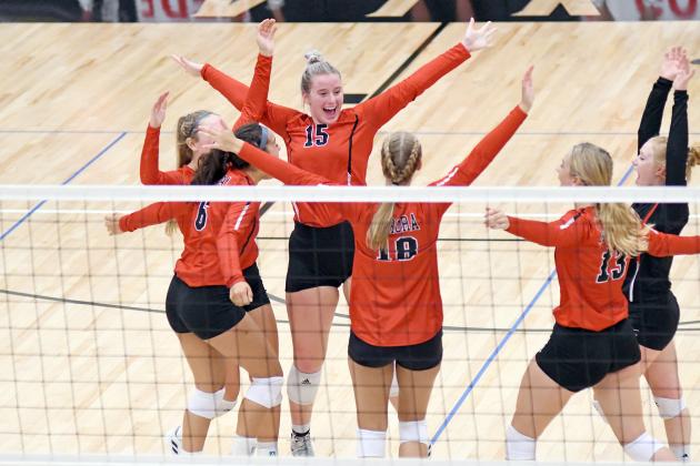 Aurora celebrates a point during its five-set win over Grand Island Northwest Sept. 21. Lexi Jones (15) recorded 25 attacks in the match as part of a winning effort. 