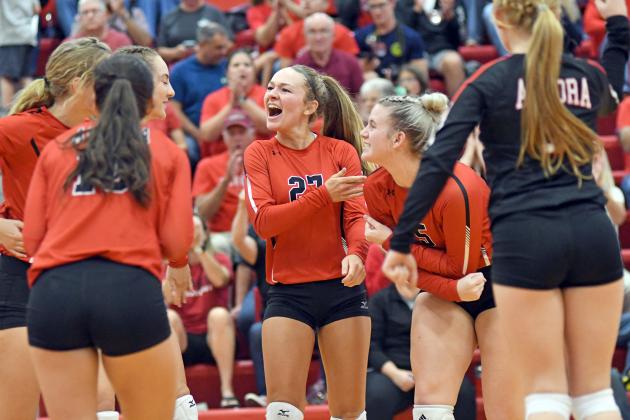Aurora celebrates a point during its five-set win over York Thursday.