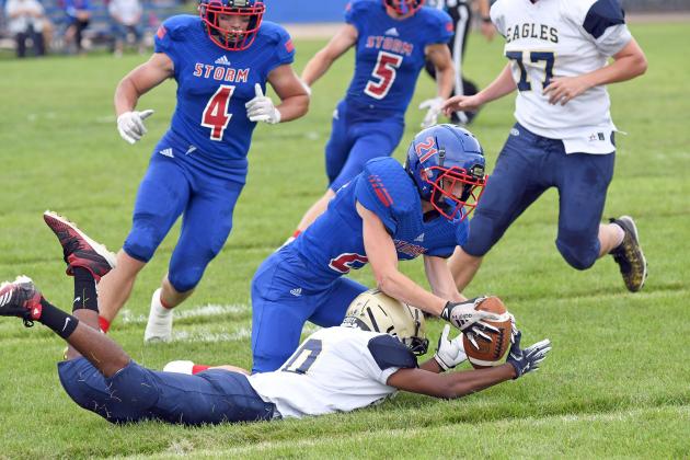 HPC’s Gavin Morris recovers a fumble during first-half action as the Storm picked up its first victory of the season Friday afternoon, a 57-14 win over Omaha Christian Academy. 