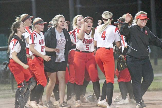 Aurora celebrates after defeating York 7-6 to win the B-7 subdistrict title and advance to its first-ever district final game slated for Friday. 