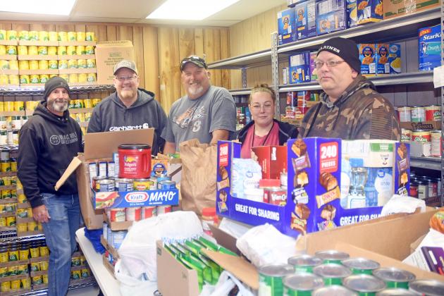 Carl Franklin (second from left) shows off his food collection donated to the Hamilton County Food Pantry Nov. 2, a total of 463.8 pounds. Those who helped Franklin include from left: George Chaney, Shawn Van Wormer, Rachel Zimmerman and Brandon Zimmerman.