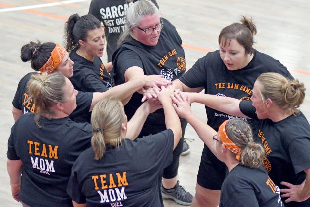 Giltner’s Moms break the huddle before taking the floor after a timeout. The Moms swept their Daughters in two during the first annual DAM game (Daughers against Mothers). 