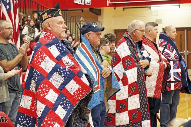 Five Aurora veterans have now joined the ranks of Quilt of Valor recipients, after a ceremony during the Nov. 11 Aurora Veterans Day program. They are, from left: Kirt Smith, Larry Gimpel, Garry Gimpel, Tim Graham and Paul Graham.